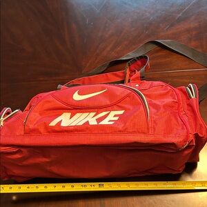 Nike duffle bag for sports or gym . Does have flaws . All zippers work .